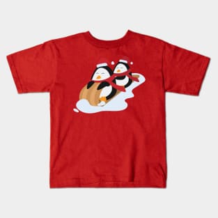 Penguins wearing santa hat Kids T-Shirt